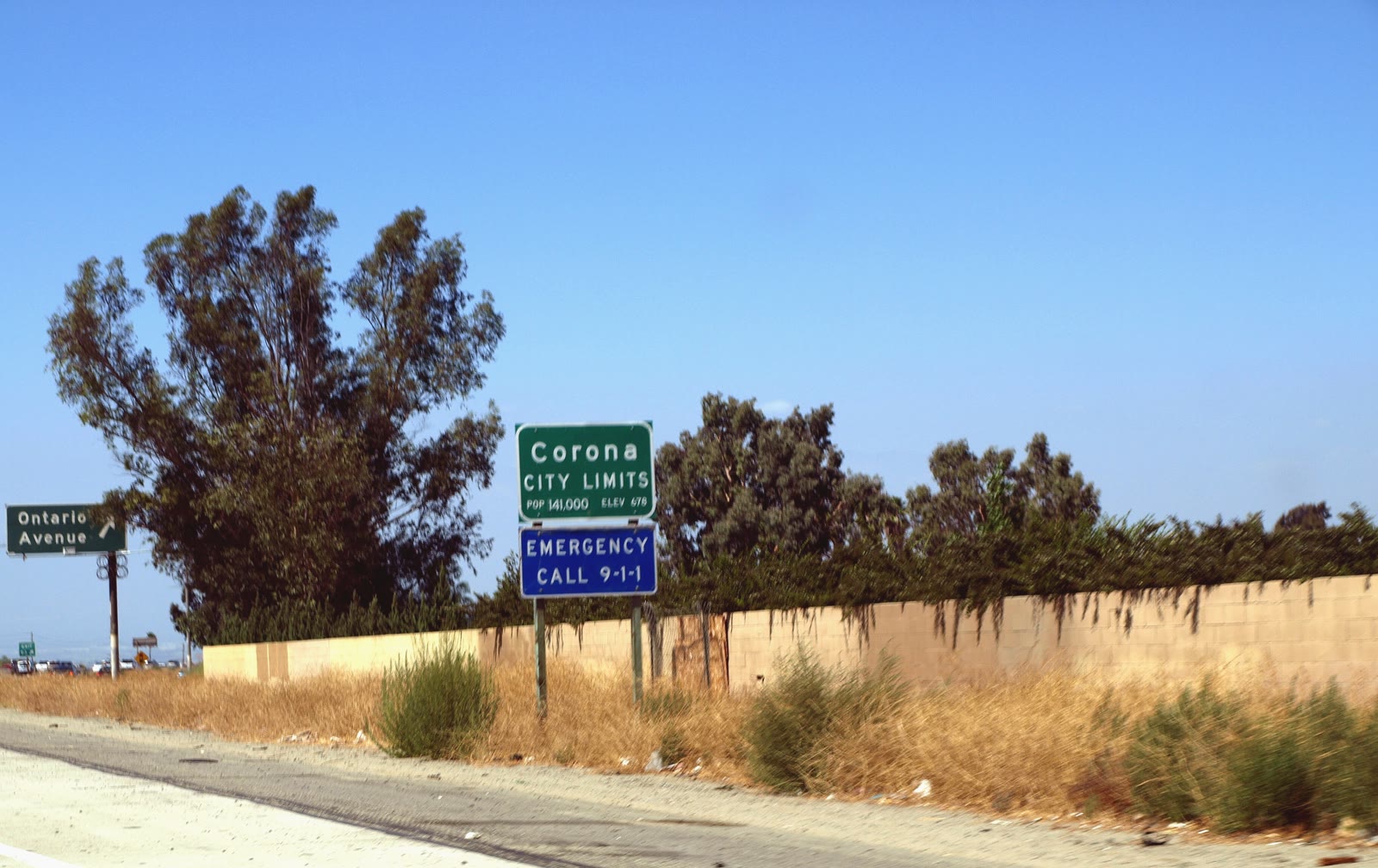 Corona city limit sign at Ontario Avenue along Interstate 15 in Corona, California